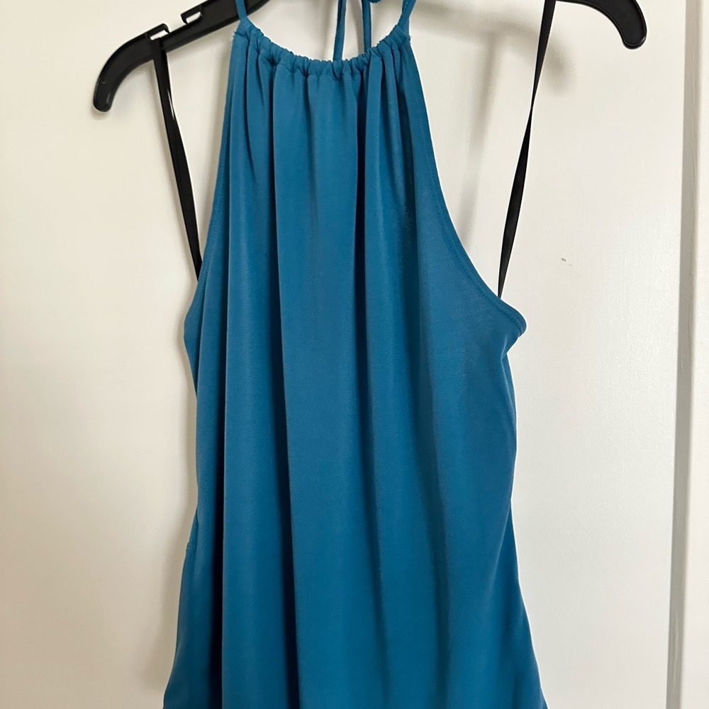 Blue BCBGeneration top. Strappy open-back detail.